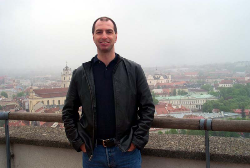 S on the observation deck at the top of the Vilnius castle, with some of the Vilnius Old Town visible behind him (May 2004)