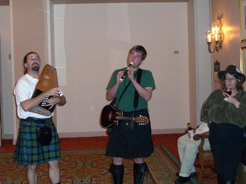 A band called "Brobdingnagian Bards" (if I'm not mistaken) plays in the hotel lobby at the ArmadilloCon 2005 in Austin, Texas. At the right is the author Rie Sheridan.