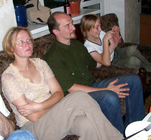 My brother J, his wife E and their son J at my parents' home. August 2005.