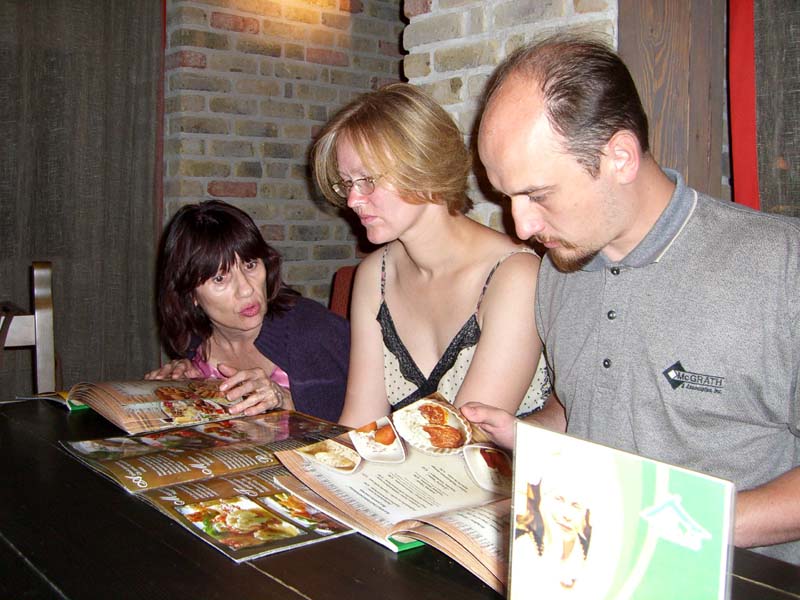 My mom, my sister-in-law E, and my brother J at the Chili Kaimas / "Chili Village" restaurant in Vilnius, August 2005