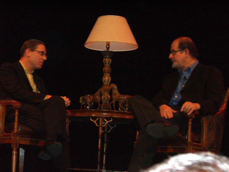 Evan Smith (left) interviewing Salman Rushdie at the Texas Book Festival in 2005