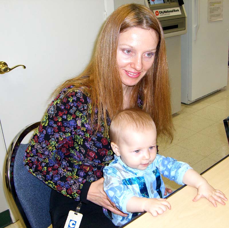 Me with E at the trick-or-treating at my then-workplace, October 2005