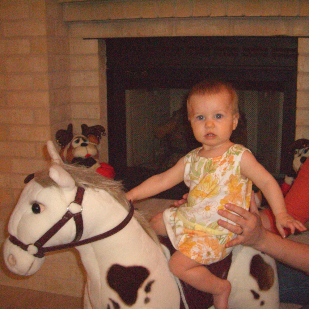 8-month-old E on a rocking horse, January 2006