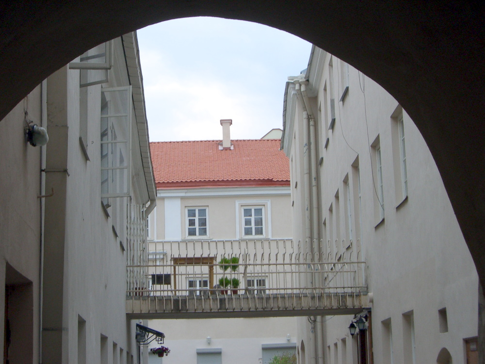 A second floor walkway or balcony connecting two buildings
