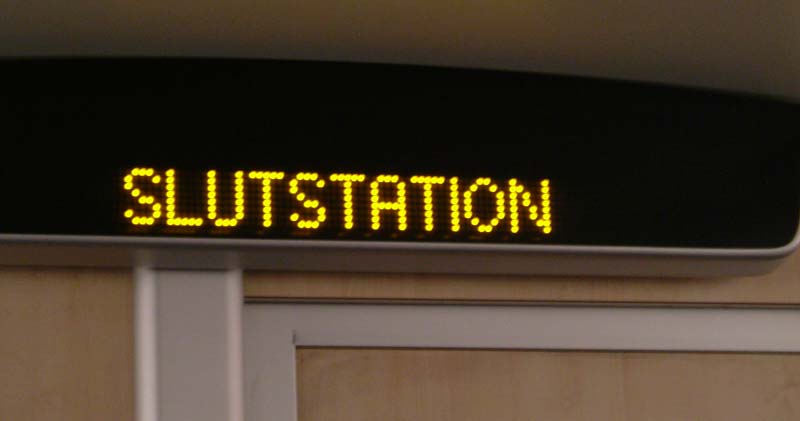 Slutstation, a sign on a billboard in a subway train in Stockholm