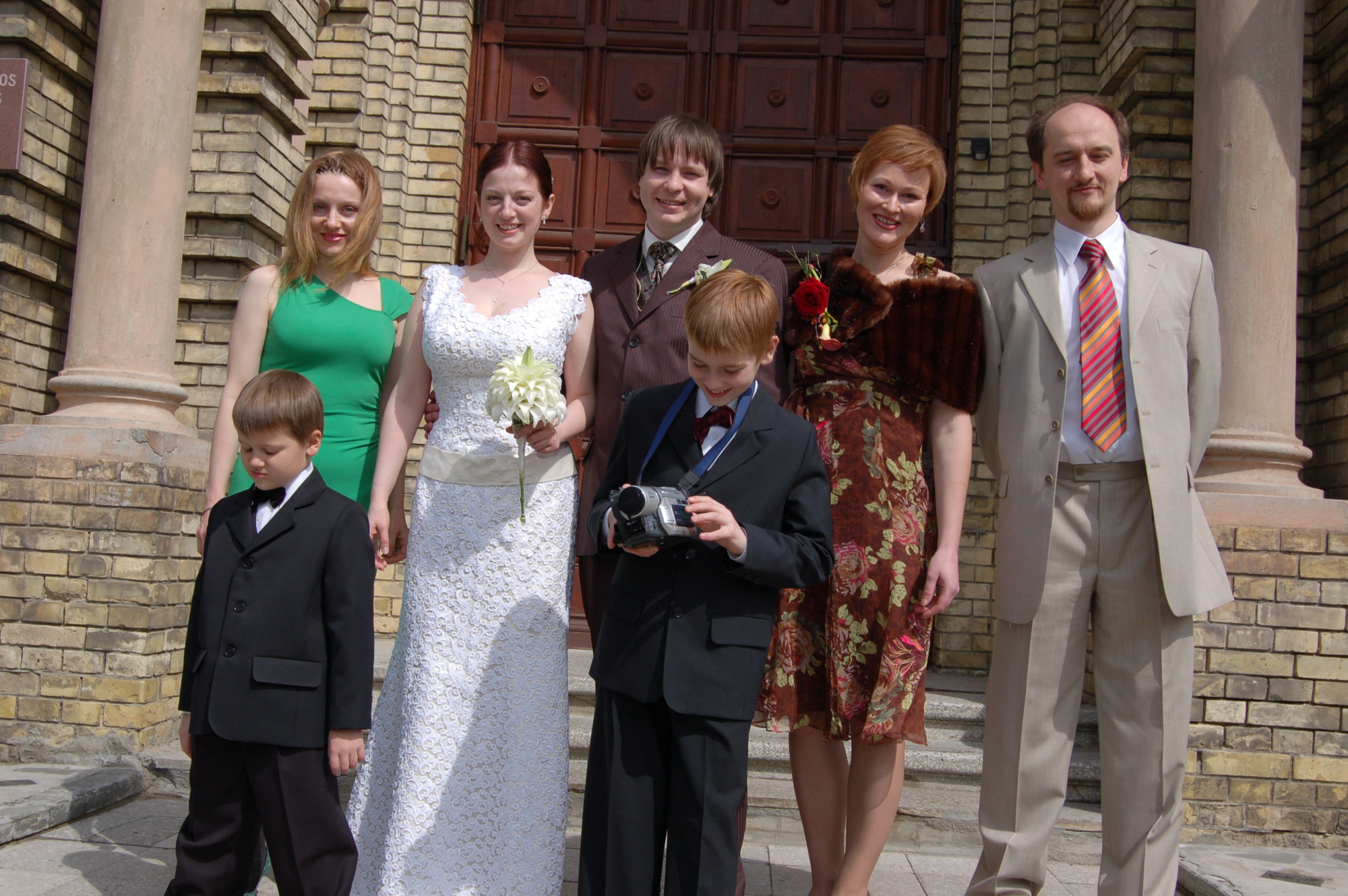 Me, my brother and his family, and the newlyweds