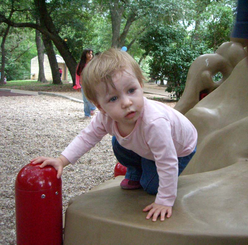 E on the slide in a park