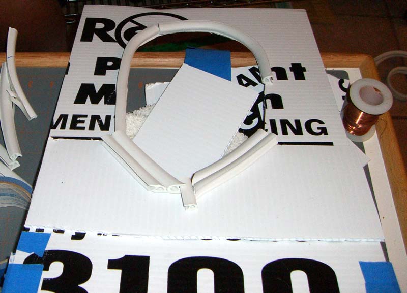 Cardboard frame with a face-shaped hole for face casting