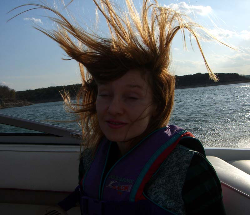 Me with wild hair on the boat