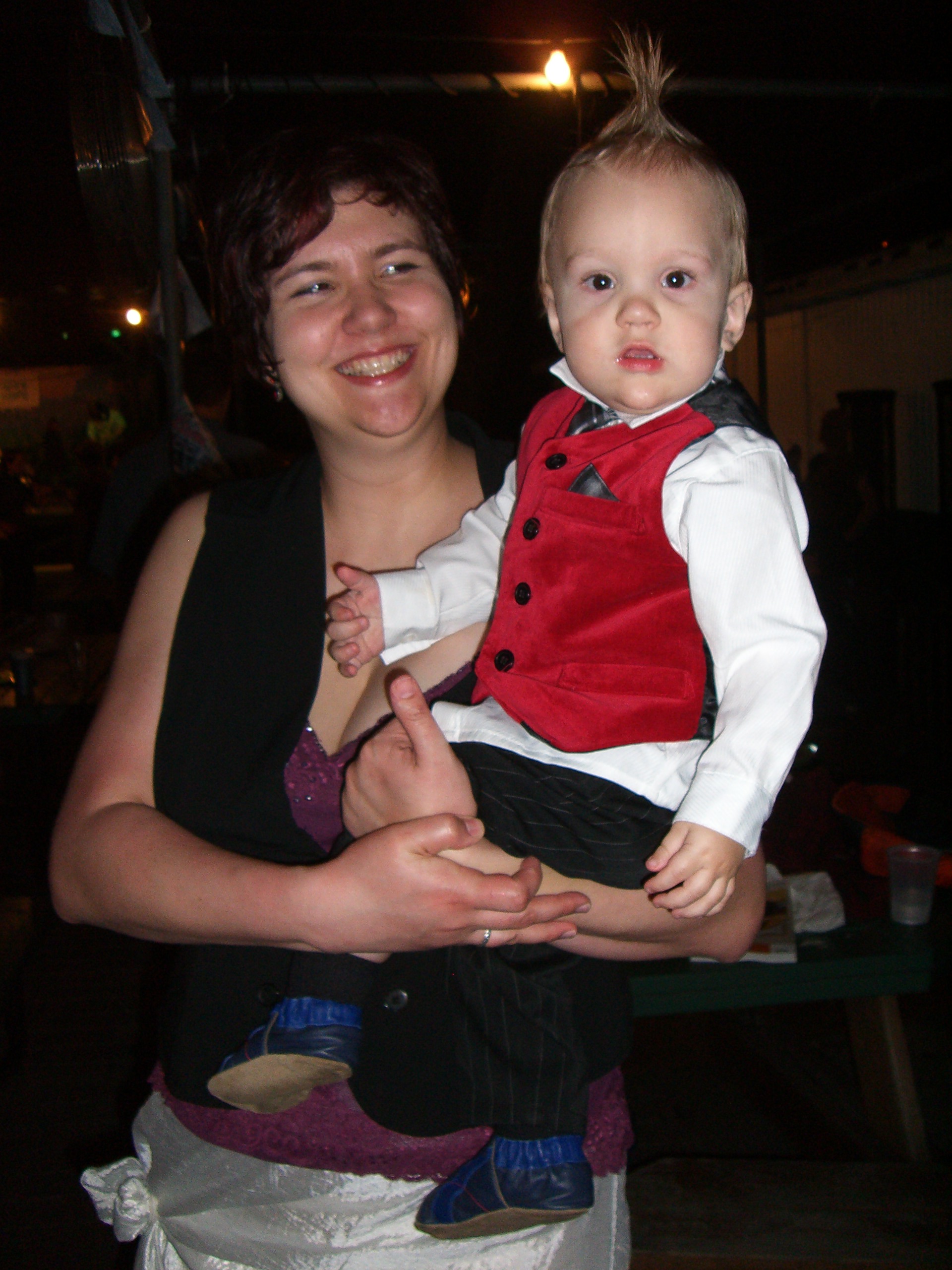 A mom and baby with a mohawk, both in steampunk costumes