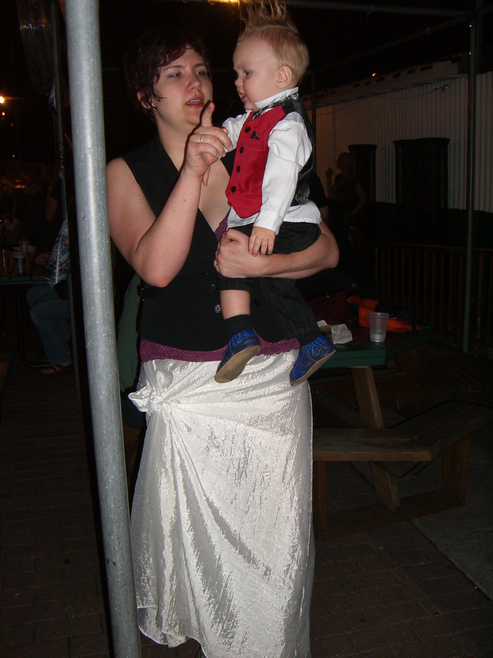 A mom and baby with a mohawk, both in steampunk costumes