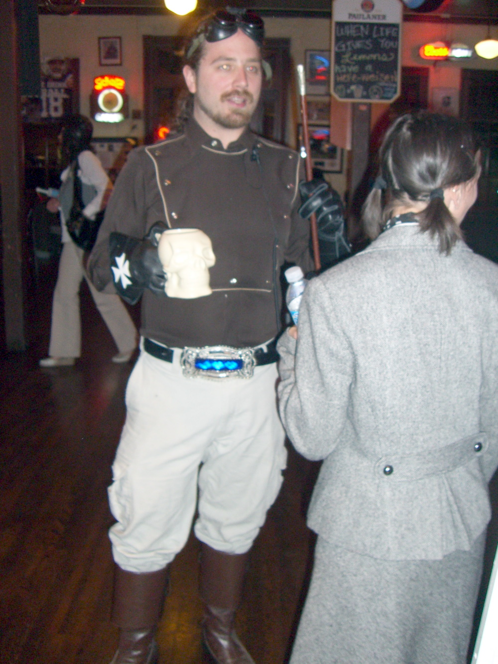 A military-themed steampunk costume with requisite goggles