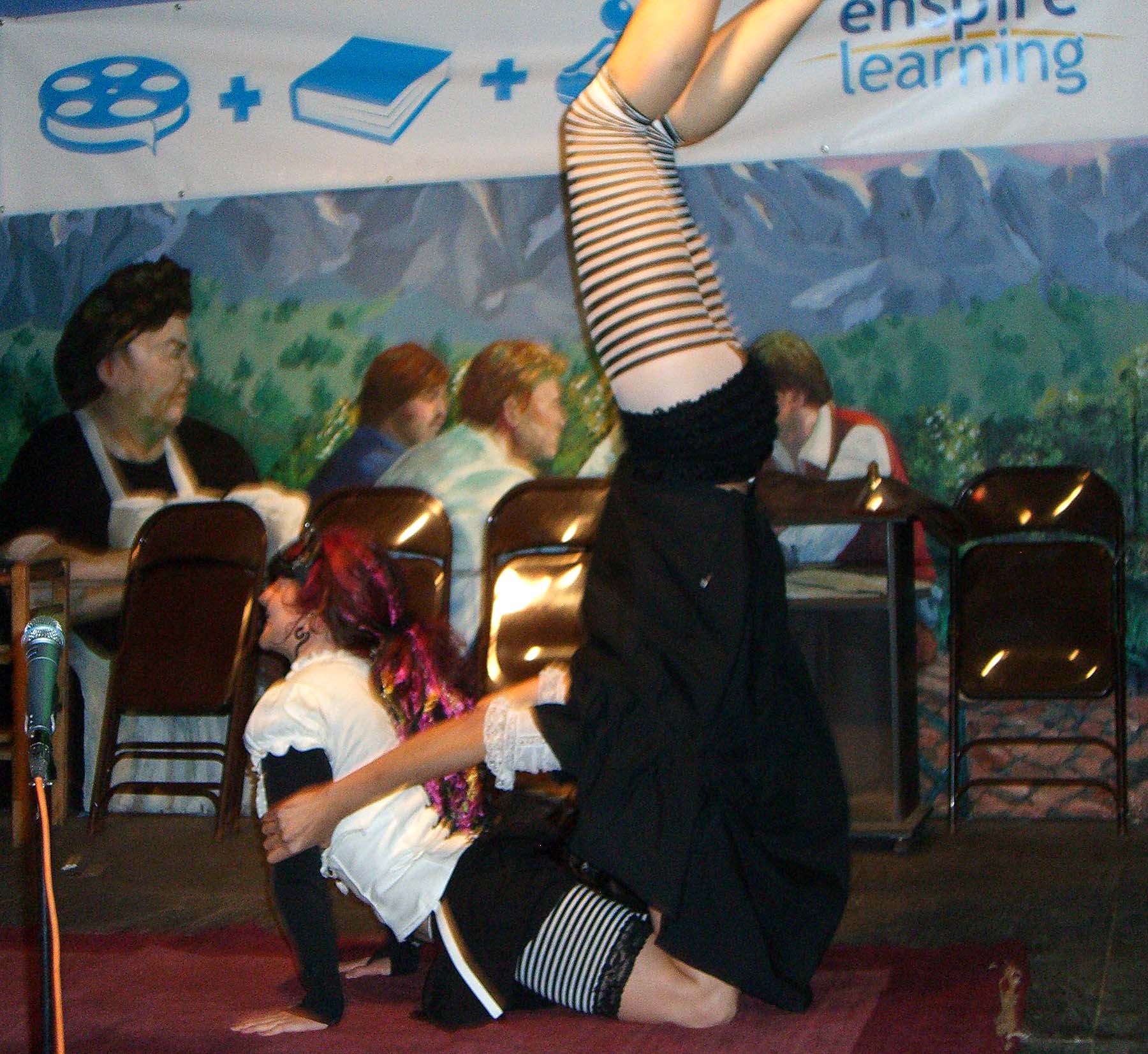 Performance of a two person acrobat troupe Popsy Purvy at the SXSW 2007 Steampunk party