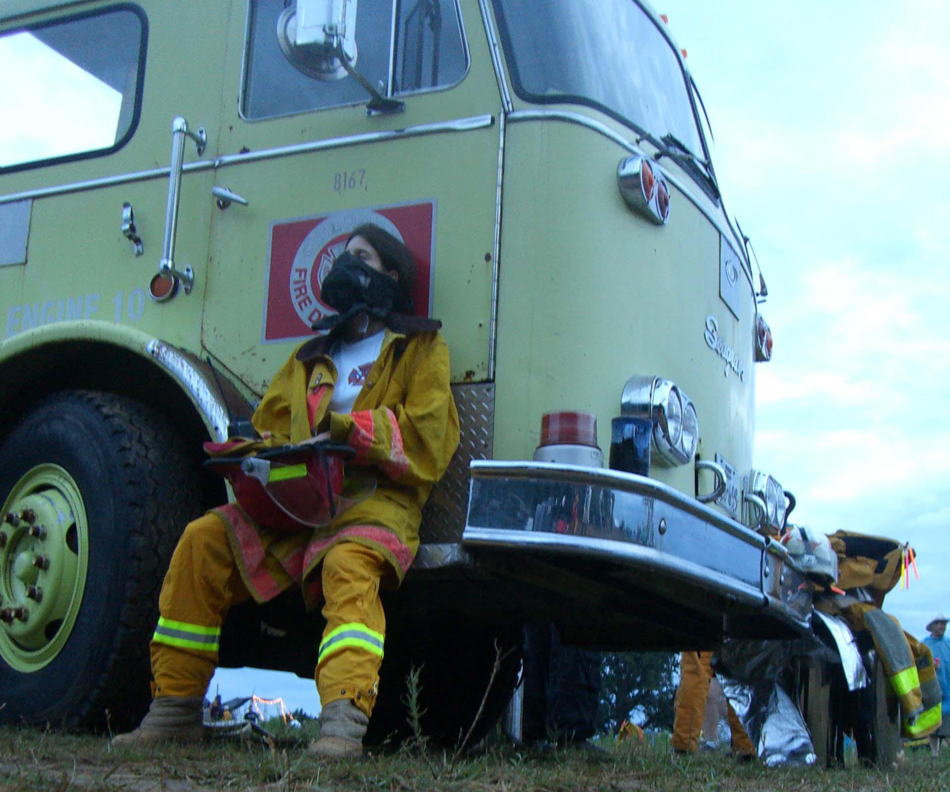 A firefighter in front of a firebus at Burning Flipside 2007