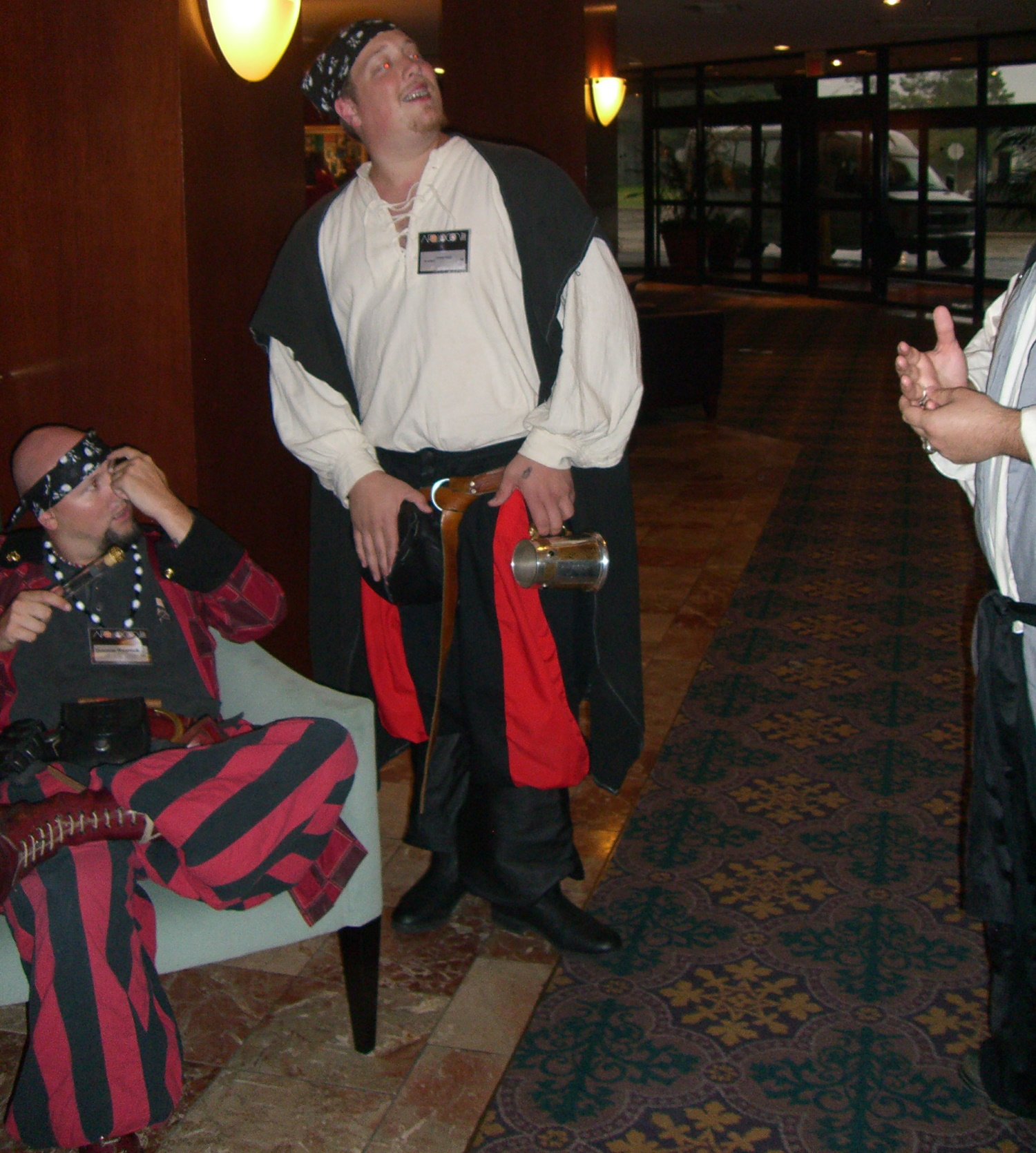 Congoers in red-and-black pirate-like costumes at ApolloCon 2007