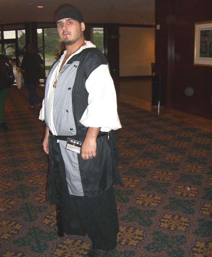 A vaguely piratoid costume, as suggested by the bandana and a loose-sleeved white shirt, seen at ApolloCon 2007