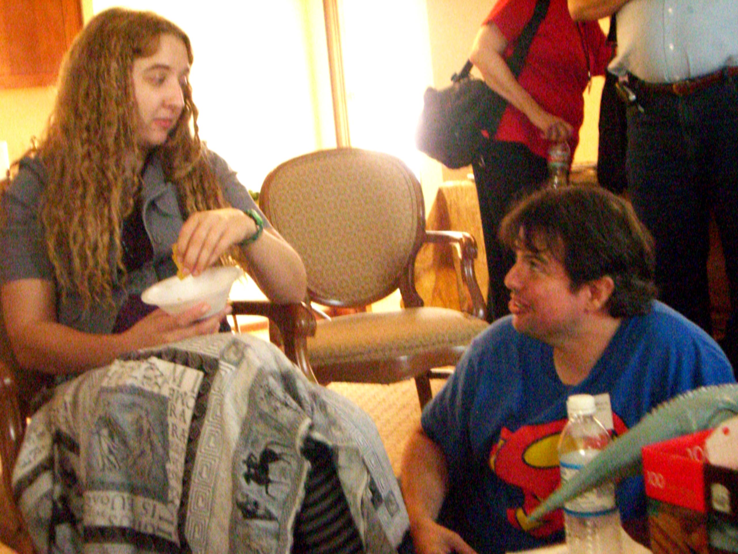 An unidentified congoer and author A. Lee Martinez (right) in the Consuite at ArmadilloCon 2007