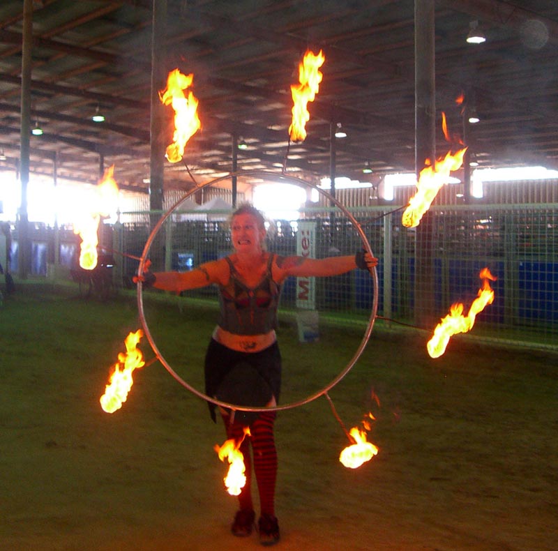Adelyn Botto spins a flaming hula hoop at the Maker Faire 2007