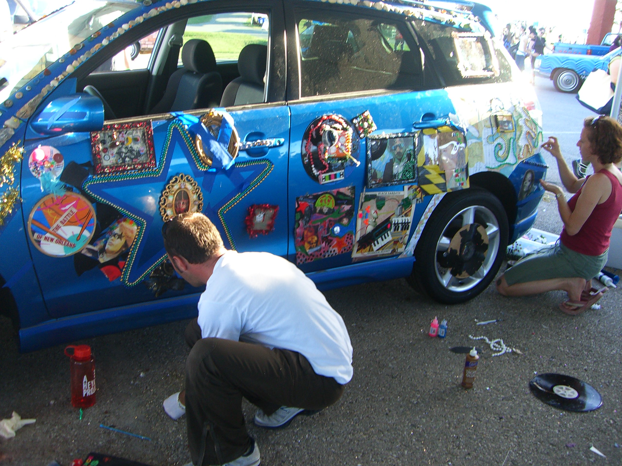 People decorating a car at Maker Faire 2007