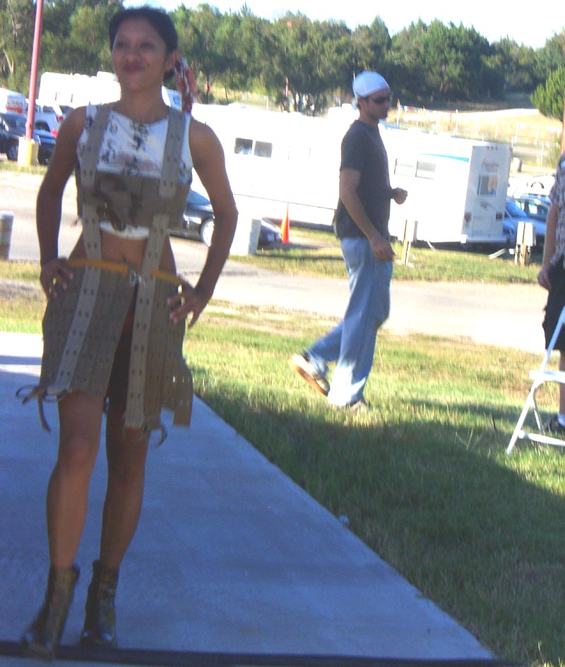 An outfit made of recycled materials that vaguely looks like backpack straps, shown at the Maker Faire 2007