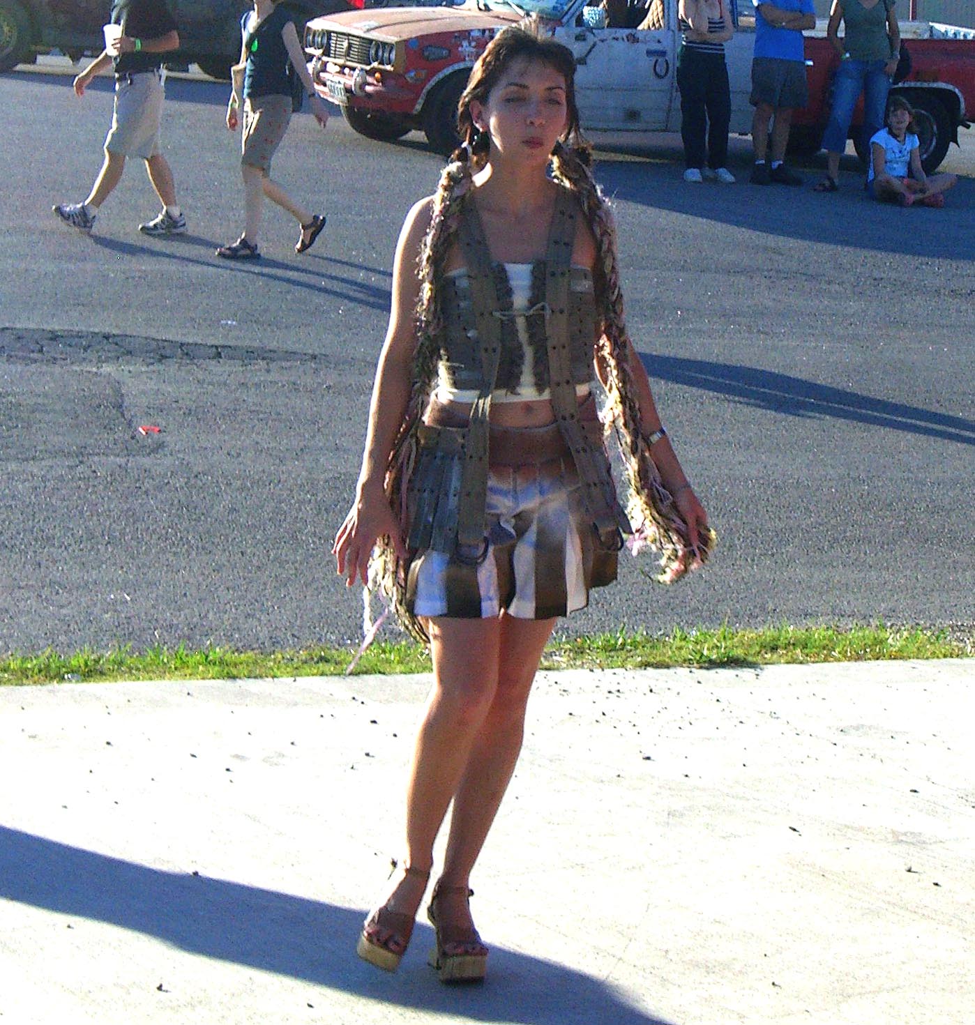 An outfit made of recycled materials, with a fringe made of something resembling backpack straps, shown at the Maker Faire 2007