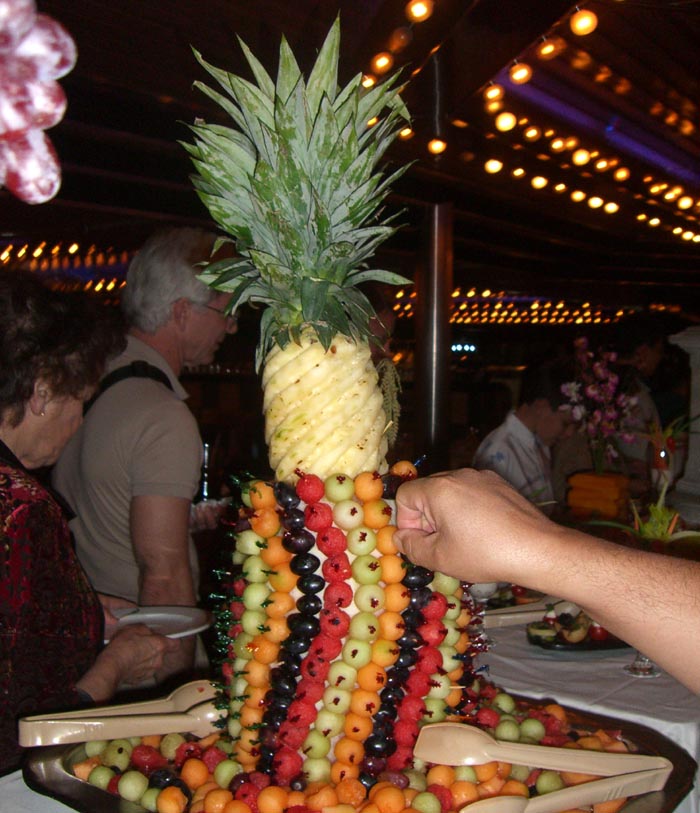 A fruit-studded pineapple at the grand gala buffet at Carnival Ecstasy cruise ship