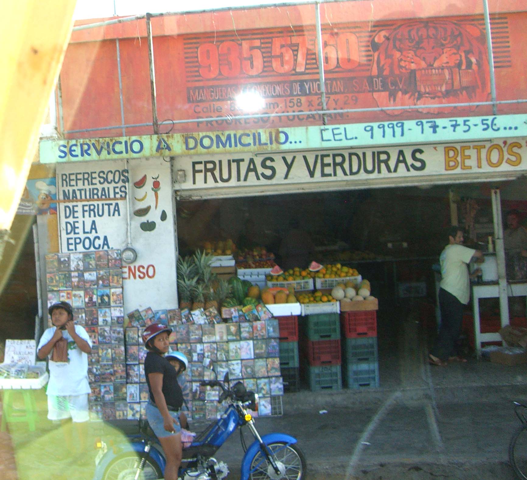 A shop in Progresso, Mexico with a sign "Frutas Y Verduras", seen out of a bus window on the way to Chichen Itza.